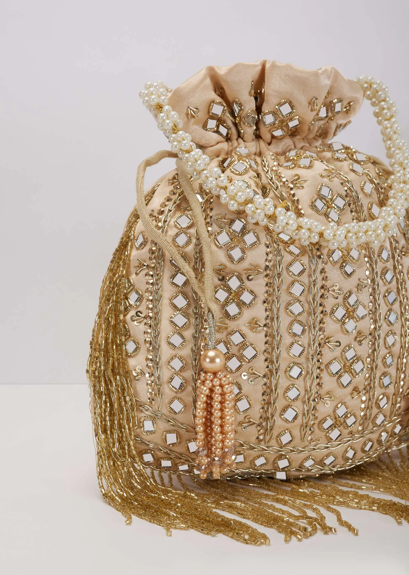 Beige Mirror Work Silk Potli With Tassels And Pearl Handle